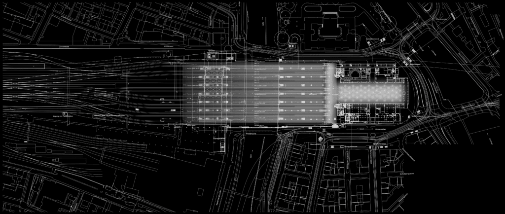 von KGRUPPE Architekten Basel - Plan des Bahnhofs und Umgebung mit Gleisanlagen und Gebäuden. Strassennamen und Infrastrukturen sind beschriftet.